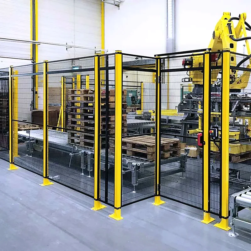 Yellow and black welded-mesh guarding around an industrial robot cell